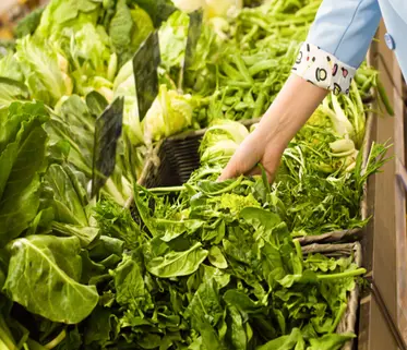 Woman choosing vegetables